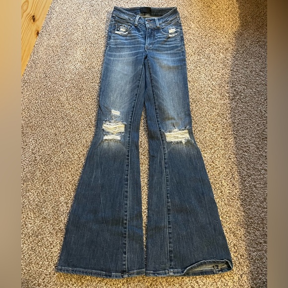 Buckle Black Flare Jeans - Picture 1 of 3